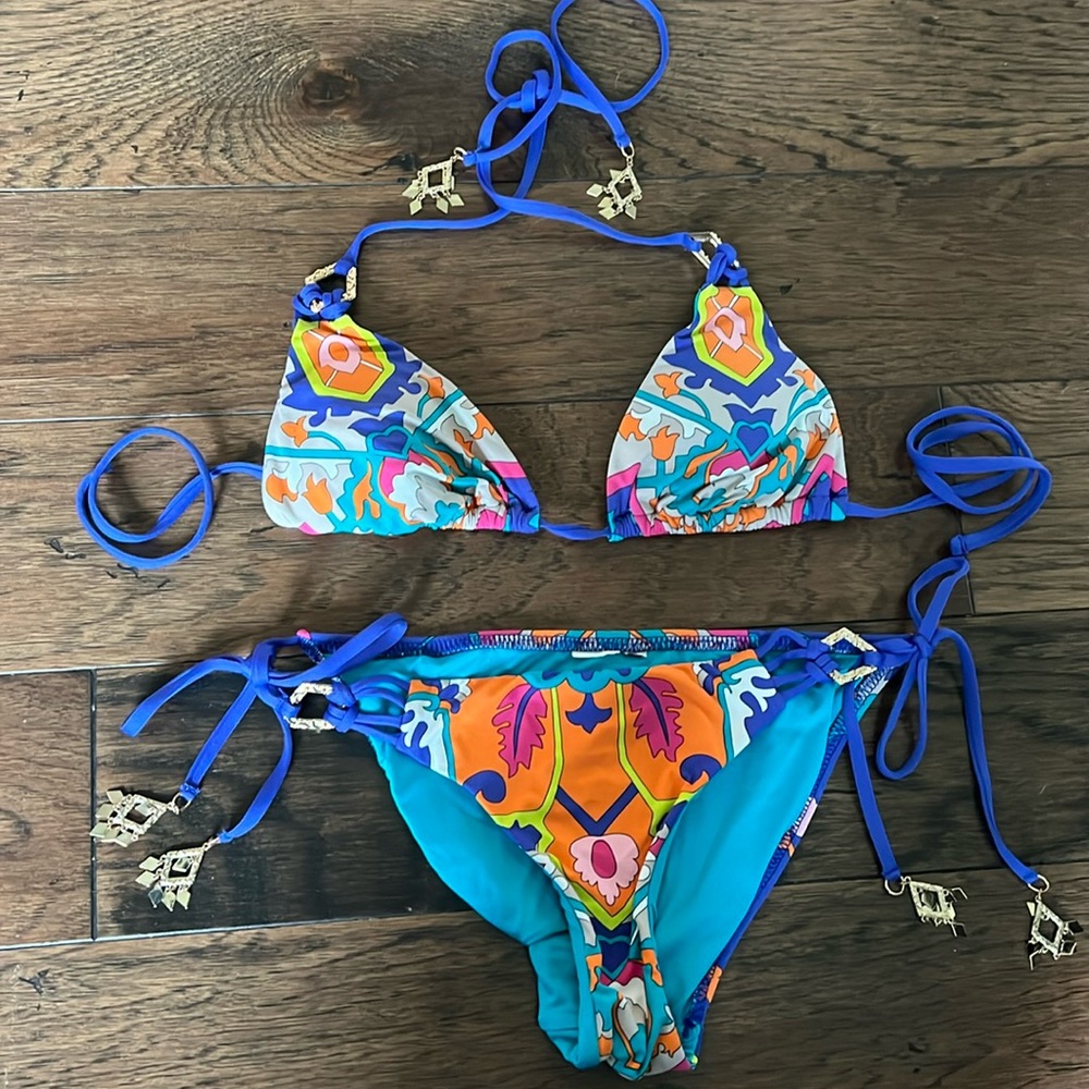 Trina Turk  bikini Size small. Never  worn but no tags. Panty protector in tact.